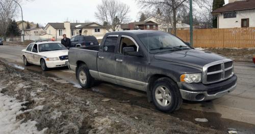 MIKE.DEAL@FREEPRESS.MB.CA 110322 - Tuesday, March 22, 2011 - The Winnipeg Police had an address on Mandalay Drive surrounded following a police involved shooting at another address in the city. A dodge truck was located at the address with a bullet hole in its side and a smashed passenger-side window. MIKE DEAL / WINNIPEG FREE PRESS