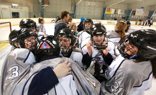 Ruth Bonneville Winnipeg Free Press March 23, 2011 Sports - West Kildonan Wolverines give their goaltender #1 Kristen Hunt a hug after winning the Female High School Hockey Championships against Fort Richmond Centurions at Keith Bodley Arena Wedensday afternoon.