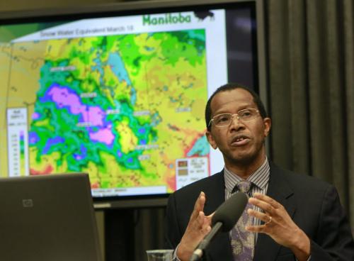WAYNE.GLOWACKI@FREEPRESS.MB.CA The province's flood forecaster Phillip Mutulu at the third 2011 spring flood outlook news conference Friday ( with a map showing the amount of water in the snow in Manitoba on March 18 and surrounding area).  .Bruce Owen story  Winnipeg Free Press  March 25 2011