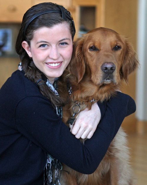 JOE.BRYKSA@FREEPRESS.MB.CA Ent- (See Mayes story )-18 yr old Colleen Furlan first-ever winner of a new bursary called the Camerata Nova Bursury for best perfprmance of a early- music piece by volcalist or choir- She poses with her golden retriever named "Duke" JOE BRYKSA/WINNIPEG FREE PRESS- Mar 27, 2011