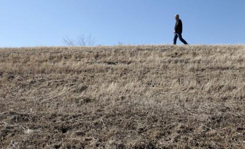 MIKE.DEAL@FREEPRESS.MB.CA 110406 - Wednesday, April 06, 2011 - Mayor of Morris, Manitoba, Gavin van der Linde walks along the top of the dike that protects the town from potential flood. See Bartley Kives story MIKE DEAL / WINNIPEG FREE PRESS