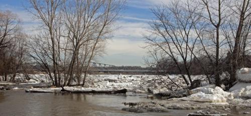 MIKE.DEAL@FREEPRESS.MB.CA 110407 - Thursday, April 07, 2011 - The Redwood bridge from the southwest shore of the Red River. An ice jam is forming at the Redwood Bridge in Winnipeg this morning. River levels are rising in the city but Amphibex machines are on standby for spot duty in the city if needed. MIKE DEAL / WINNIPEG FREE PRESS