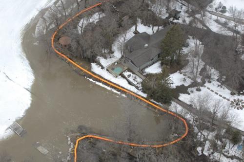 MIKE.DEAL@FREEPRESS.MB.CA 110408 - Friday, April 08, 2011 - The Red River flyover north of Winnipeg during the 2011 Flood. Buildings along Netley Creek just south of Petersfield, MB still have frozen water. MIKE DEAL / WINNIPEG FREE PRESS