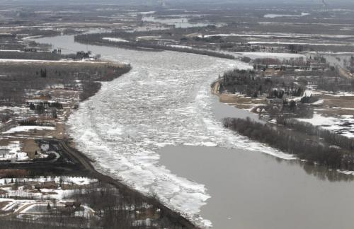 MIKE.DEAL@FREEPRESS.MB.CA 110408 - Friday, April 08, 2011 - The Red River flyover north of Winnipeg during the 2011 Flood. Looking south the ice jam can be seen on the Red River north of Selkirk, MB. The Bridge to Nowhere on Hwy 4 can be seen in the distance. MIKE DEAL / WINNIPEG FREE PRESS