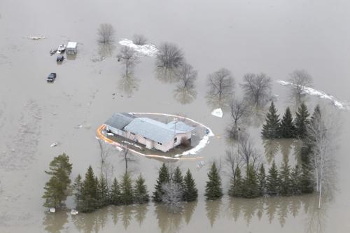 MIKE.DEAL@FREEPRESS.MB.CA 110408 - Friday, April 08, 2011 - The Red River flyover north of Winnipeg during the 2011 Flood. A house with a breached sandbag dike sits flooded off Breezy Point Rd. north of Selkirk. MIKE DEAL / WINNIPEG FREE PRESS