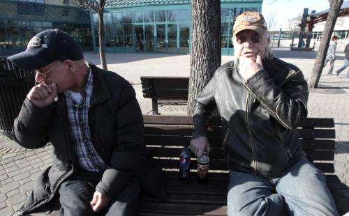 MIKE.DEAL@FREEPRESS.MB.CA 110412 - Tuesday, April 12, 2011 - Provincial budget streeter Dan Johnson (right) and a friend enjoy the late afternoon sun at The Forks and talk about what they would have liked to see in the provincial budget. See Melissa Martin story. MIKE DEAL / WINNIPEG FREE PRESS