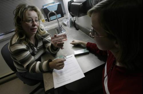 John Woods / Winnipeg Free Press / November 1, 2006 - 061101 - Lisa Goss, a reproductive health co-ordinator at Klinic, talks about the birth control pill Allesse with twenty-four year old Robyn Wednesday, Nov. 1/06.  Allesse is in short supply in Canada.