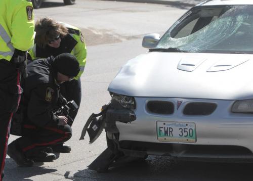 MIKE.DEAL@FREEPRESS.MB.CA 110413 - Wednesday, April 13, 2011 - A pedestrian, Joanna Storm,  was hit by a car at a crosswalk on Henderson Hwy between Mossdale Ave and Frasers Grove. The car traveled about a half a block before stopping after hitting the person. MIKE DEAL / WINNIPEG FREE PRESS. On August 1 2012, Jarrett Carleton pleaded guilty to dangerous driving causing death following the April 2011 accident on Henderson Highway.