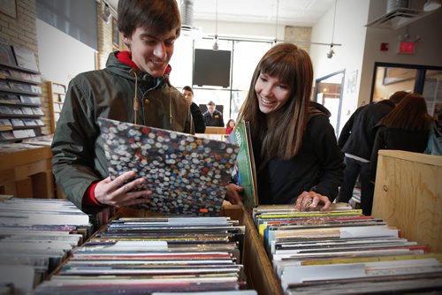 Winnipeg, Manitoba - 110416 -Justus Zimmerly and Natalie Wiebe look for some favourites at the Winnipeg Folk Festival Music Store at Record Store Day on Saturday, April 16, 2011. (JOHN.WOODS@FREEPRESS.MB.CA)
