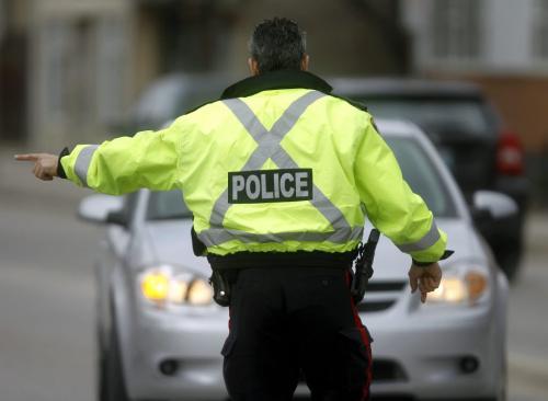 TREVOR HAGAN / WINNIPEG FREE PRESS - Over the weekend, police officers operate a check stop along Broadway that resulted in tickets being issued to uninsured and unlicensed drivers.  11-04-17