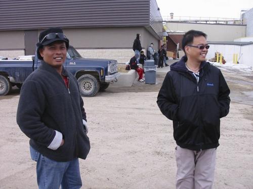 Olivan Afuang (wearing sunglasses over his eyes) and Efren Macatangay are Filipino immigrants to Neepawa, in front of the HyLife hog plant. Efren works in the plant and Olivan is a registered nurse.  Olivan Afuang is on the left, Efren Macatangay on the right. bill redekop / winnipeg free pressbill redekop / winnipeg free press
