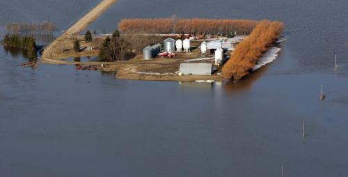 JOE.BRYKSA@FREEPRESS.MB.CA Near St Jean Baptiste, Manitoba- ( See Lindor's story)-   Farmers properties are surrounded by the flooded Red River near the town of St Jean Baptiste Wednesday morning- Manitoba. St Jean Baptiste  is located along Highway 75, 40 km north of Emerson at the United States border-after the great flood of 1997 farmers were funded to raise their properties for protection from flood waters -JOE BRYKSA/WINNIPEG FREE PRESS- Apr 20, 2011