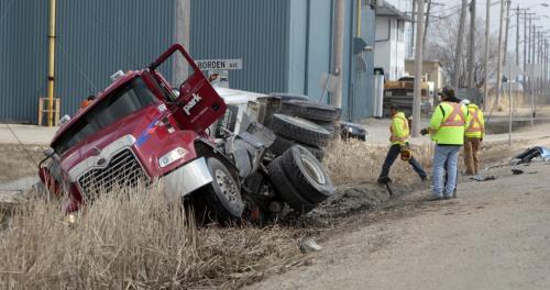 MIKE.DEAL@FREEPRESS.MB.CA 110420 - Wednesday, April 20, 2011 - A semi-trailer and a car collided head on at Dugald Road and Borden Avenue just before the lunch-hour today. Dugald was closed between Plessis and Ravenhurst for a few hours, no reports on the injuries. MIKE DEAL / WINNIPEG FREE PRESS