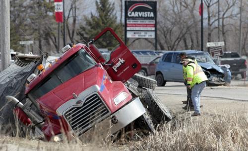 MIKE.DEAL@FREEPRESS.MB.CA 110420 - Wednesday, April 20, 2011 - A semi-trailer and a car collided head on at Dugald Road and Borden Avenue just before the lunch-hour today. Dugald was closed between Plessis and Ravenhurst for a few hours, no reports on the injuries. MIKE DEAL / WINNIPEG FREE PRESS