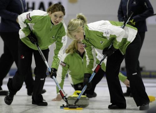 John Woods / Winnipeg Free Press / November 3, 2006 - 061103  - Christine Keshen, lead on team Kleybrink sweeps in a tournament at the Asham Curling Club Friday Nov 3/06.