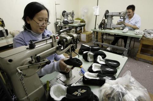 John Woods / Winnipeg Free Press / November 3, 2006 - 061103  - Hoa Tran (L) and Kareen Murdock complete some slippers at Fleece Line Friday Nov 3/06.   Sean McCormick, the owner of Fleece Line, recently moved the company to Winnipeg from Brandon.
