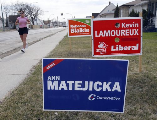 KEN GIGLIOTTI / WINNIPEG FREE PRESS / APRIL 27 2011 Stdup Video -  WALK , DRIVE ,RUN  "Just Vote" intended to be a politically neutral   video  that video takes a random election sign survey along  main routes  showing  political spirit of voters by their participation in sign use  in various  areas of the city.These areas are also  routes  voters take into the city on their way to work or shop. There are random streeter voice clips of people encouraging  the "just vote" theme for the video.In pic three candidate signs on  a lawn  on Mountain Ave . The  video was edited expertly  by our RRC intern Jeremie Wookey  who Tuesday night won a Broadcasters of Manitoba Award for excellence in radio and Television production .