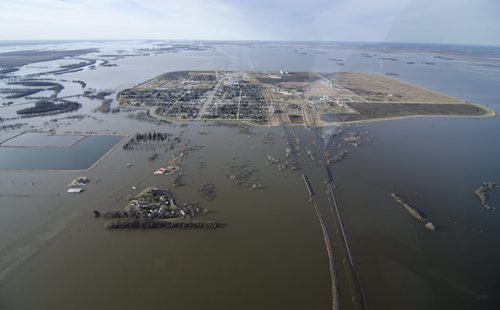 DAVID LIPNOWSKI / WINNIPEG FREE PRESS (April 28, 2011) The town of Morris, Manitoba remains protected from the Morris River and the Red River by a ring dike surrounding the town, though the main bridge into the town on Highway 75 is under water Thursday April 28th, 2011.