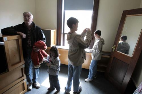 MIKE.DEAL@FREEPRESS.MB.CA 110507 - Saturday, May 07, 2011 -  Raymond Shirritt-Beaumont looks around the residence room his grandfather, Henry Beaumont, stayed in while he was taking Agriculture in 1913-1915. Raymond and his children, Liam, 13, Kieran, 11, and Emmeline, 5, took the oportunity of the open house held at the UofM's Tache residence to have a look. MIKE DEAL / WINNIPEG FREE PRESS