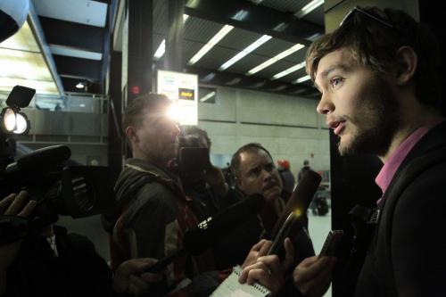 MIKE.DEAL@FREEPRESS.MB.CA Manitoba Moose goalie Eddie Lack is interviewed at the airport after the team arrived back in Winnipeg the day after being eliminated from the playoffs.  Mike Deal / Winnipeg Free Press