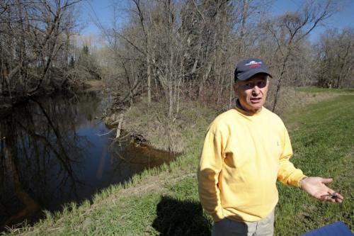 MIKE.DEAL@FREEPRESS.MB.CA 110514 - Saturday, May 14, 2011 -  Ron Owens  lives about 30 yards from the Elm River (background) and about two miles from the Hoop and Holler cut in the Assiniboine River.  See Bruce Owen story. MIKE DEAL / WINNIPEG FREE PRESS