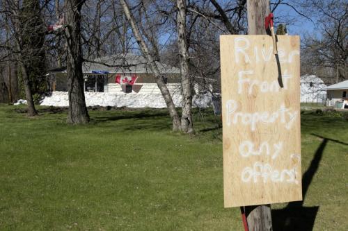 MIKE.DEAL@FREEPRESS.MB.CA 110514 - Saturday, May 14, 2011 -  A house sits empty about 30 yards from the Elm River and about two miles from the Hoop and Holler cut in the Assiniboine River.  See Bruce Owen story. MIKE DEAL / WINNIPEG FREE PRESS