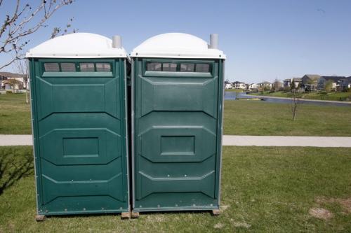 BORIS.MINKEVICH@FREEPRESS.MB.CA   BORIS MINKEVICH / WINNIPEG FREE PRESS 110516 Some portable toilets near the area in Island Lakes where the displaces Dragon Boats are stationed until the river goes down. De La Seigneurie Boulevard. Some Jr. high students from Winnipeg on the lake training.