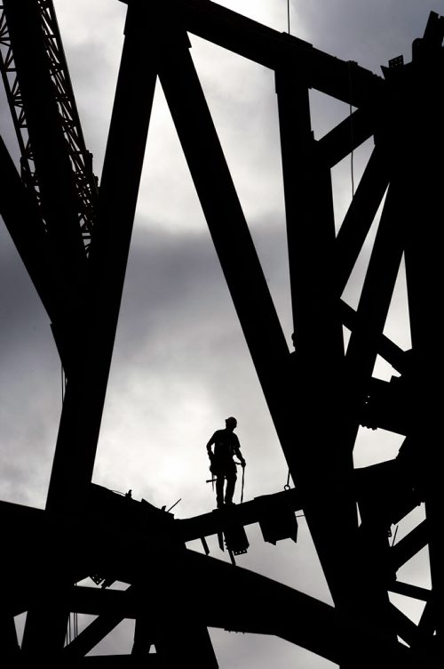 KEN GIGLIOTTI / WINNIPEG FREE PRESS / May 20 2011 - STDUP - Look Up Look Way Up - ironl worker walks across a beam over 100 ft in the air on the steel superstructure that will support the glass exterior  of the Canadian Museum for Human Rights CMHR