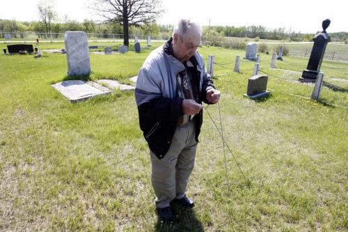 BORIS.MINKEVICH@FREEPRESS.MB.CA   BORIS MINKEVICH / WINNIPEG FREE PRESS 110525 Jack Mavins is a grave witcher. Here he shows his stuff at an old cemetery near Dugald, Manitoba.