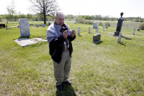 BORIS.MINKEVICH@FREEPRESS.MB.CA   BORIS MINKEVICH / WINNIPEG FREE PRESS 110525 Jack Mavins is a grave witcher. Here he shows his stuff at an old cemetery near Dugald, Manitoba.