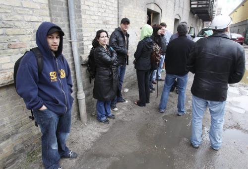 BORIS.MINKEVICH@FREEPRESS.MB.CA   BORIS MINKEVICH / WINNIPEG FREE PRESS 110527 U2 fans hang out in the rain behind the Burton Cummings Theatre in an effort to catch a glimpse of the Irish rock band.