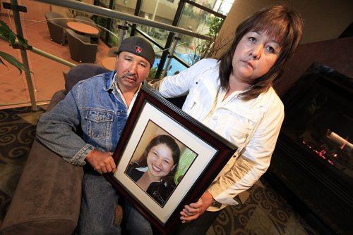 Winnipeg, Manitoba - May 27, 2011 -  Bernice  Catcheway with her husband Wilfred pose for a photograph of their missing daughter Jennifer at the Clarion Hotel on Friday, May 27, 2011.  (John Woods/Winnipeg Free Press)