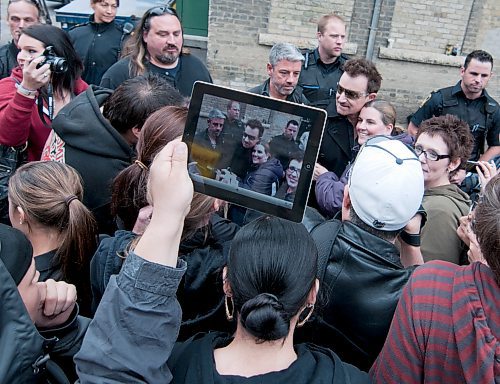 David Lipnowski / Winnipeg Free Press (May 27, 2011) Bono greets fans at the back entrance of the Burton Cummings Theatre Friday afternoon. Bono and the band took time to shake hands, sign autographs, hug fans, and pose for photos after coming straight from the airport. U2 is performing at Canad Inns Stadium Sunday night as part of their U2 360 world tour.