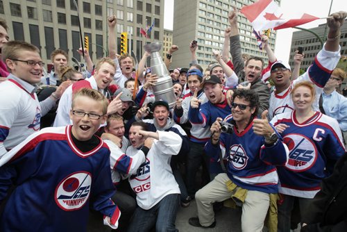 MIKE.DEAL@FREEPRESS.MB.CA 110531 - Tuesday, May 31, 2011 -  Hockey fans gathered at Portage and Main to celebrate the return of the NHL to Winnipeg, MB. Fans cheer as Dancing Gabe arrives at Portage and Main. MIKE DEAL / WINNIPEG FREE PRESS
my2011poy