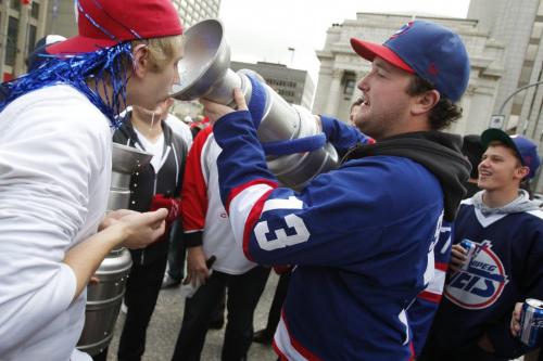 BORIS.MINKEVICH@FREEPRESS.MB.CA   BORIS MINKEVICH / WINNIPEG FREE PRESS 110531 Beer chugging happy NHL fans toast at Portage and Main to the news of an NHL team coming to Winnipeg.