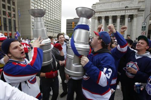 BORIS.MINKEVICH@FREEPRESS.MB.CA   BORIS MINKEVICH / WINNIPEG FREE PRESS 110531 Beer chugging happy NHL fans toast at Portage and Main to the news of an NHL team coming to Winnipeg.