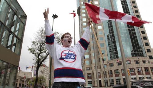 MIKE.DEAL@FREEPRESS.MB.CA 110531 - Tuesday, May 31, 2011 -  Hockey fans gathered at Portage and Main to celebrate the return of the NHL to Winnipeg, MB. Cassidy Dankochik starts yelling "Go Jets Go!" as he arrives at Portage and Main. MIKE DEAL / WINNIPEG FREE PRESS
