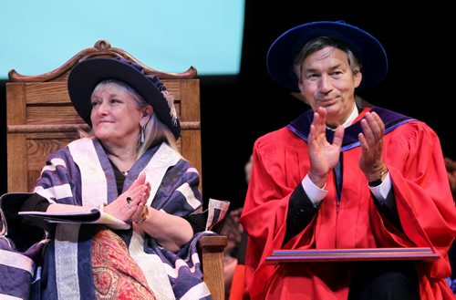 Brandon Sun Brandon University President Deborah Poff and Canadian Ambassador to the United States Gary Doer applaud at the university's 100th convocation ceremonies this morning. Doer was bestowed with an honorary degree. (Tim Smith/Brandon Sun)