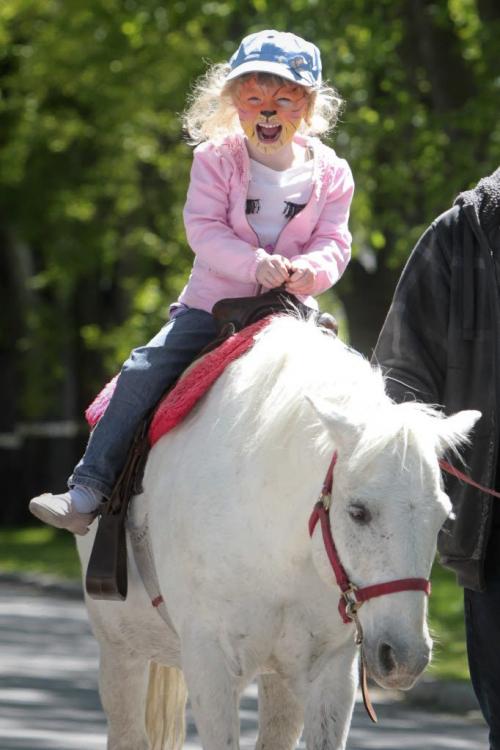 MIKE.DEAL@FREEPRESS.MB.CA 110604 - Saturday, June 04, 2011 -  Abby Aikman, 4, rides Cloudy the pony while volunteer Justin Langton leads the way during the Academy Street Festival Saturday afternoon. MIKE DEAL / WINNIPEG FREE PRESS
