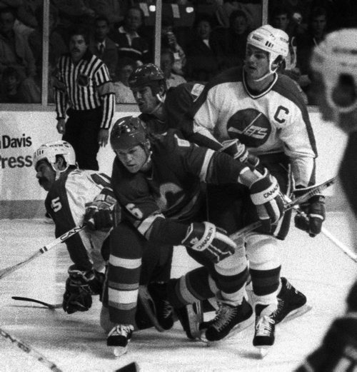 Winnipeg Free Press / Wayne Glowacki /  Oct 24 1986 -  Dale Hawerchuk  and Paul MacLean battle  through clutch and grab style of common in the NHL in gane with bitter rival Calgary Flames  Photo Book Project - Wpg Winnipeg Jets Hockey Club - NHL National Hockey League return -  ( kgjets brings up all Wpg Jets recovered photos in Merlin new book project pics will have slug newjets  for archive pics put in after june 7 2011 )  photos cannot be  published without written permission from the Winnipeg Free Press and credit must include  the Winnipeg Free Press and photographer with each photo
