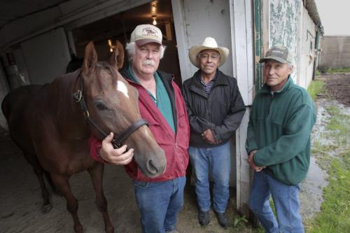 MIKE.DEAL@FREEPRESS.MB.CA 110622 - Wednesday, June 22, 2011 -  (l-r) The Colonal's Cat, Jimmy Ray Jr., Amalia Trejo and Wendell Matt. Jimmy Ray Jr. with The Colonal's Cat, who broke his maiden at the last race before the two week layoff due to the Red River Ex. The trio are among a group of horsemen who have brought their horses here after their track in Arazona shut down suddenly leaving over 750 horses with nowhere to race. See Allan Besson story. MIKE DEAL / WINNIPEG FREE PRESS