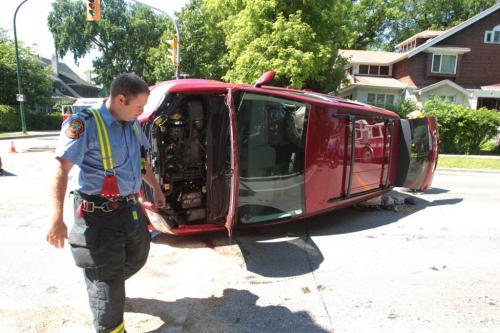 MIKE.DEAL@FREEPRESS.MB.CA At least one person was transported to the hospital after a van flipped when it collided with a car at the intersection of Harrow and Grosvenor around noon. No report on the condition of the patient.  Mike Deal / Winnipeg Free Press