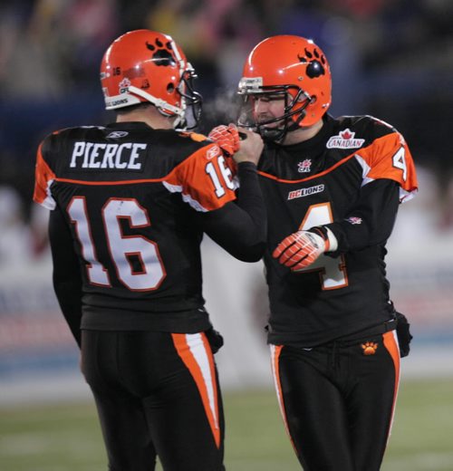 JOE BRYKSA / WINNIPEG FREE PRESS  BC Lions QB Buck Pierce congratulates kicker Paul McCallum after his field goal taking the score to 25-12 for the Lions during 4th quarter action of the 94th 2006 Grey Cup game at Canad Inns Stadium Sunday evening, Nov. 19, in Winnipeg. 061119  GREYCUP2006 SPORTS