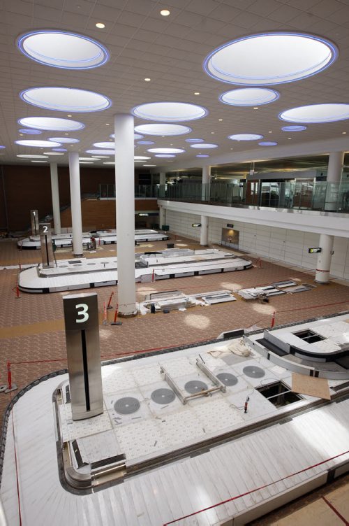 WINNIPEG FREE PRESS/  KEN GIGLIOTTI  / JUNE 24 2011- Gord Sinclair  story - James Richardson International Airport  construction continues - passenger arrival baggage pick up , featuring skylights ripped with blue neon lights