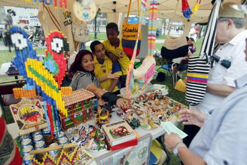 BORIS.MINKEVICH@FREEPRESS.MB.CA   BORIS MINKEVICH / WINNIPEG FREE PRESS 110626 Diane Arizala at the Columbian tent with her husband Erik and son Kevin. Central Park.