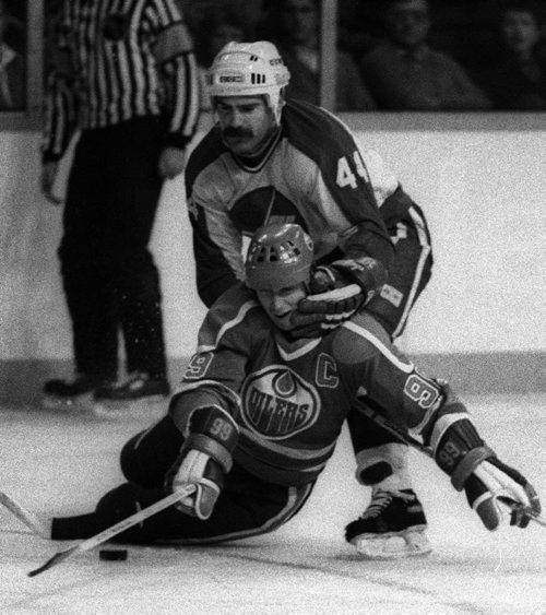 Winnipeg Free Press / Phil Hossack / Feb 6 1995  -  Jets  Dave Babych gets a hold on Edmonton's Wayne Gretzky - Photo Book Project - Wpg Winnipeg Jets Hockey Club - NHL National Hockey League return -  ( kgjets brings up all Wpg Jets recovered photos in Merlin new book project pics will have slug newjets ( 147 new photos added June 2011  -  for archive pics put in after june 7 2011) - ***These next Photos slugged newjets2 for photos afterJune 14 20011 )  photos cannot be  published without written permission from the Winnipeg Free Press and credit must include  the Winnipeg Free Press and photographer with each photo -
