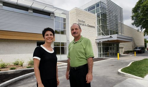 WAYNE.GLOWACKI@FREEPRESS.MB.CA At left, Raymonde Gagne, pres. and Rene Dupuis, project manager with the College universitaire de Saint-Boniface outside the adjoining Pavillon Marcel-A.-Desautels that will officially open June 28th.    Embargo:This is for Tuesday June 28 paper, pls don't put it on web earlier.Nick Martin story Winnipeg Free Press June 27  2011