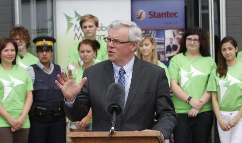 BORIS.MINKEVICH@FREEPRESS.MB.CA   BORIS MINKEVICH / WINNIPEG FREE PRESS 110629 Greg Selinger talks to the crowd at a mentoring youth press conference at Santec.