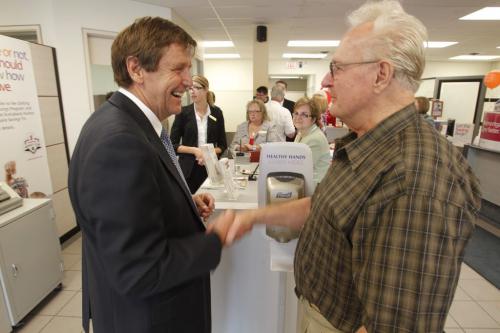 BORIS.MINKEVICH@FREEPRESS.MB.CA   BORIS MINKEVICH / WINNIPEG FREE PRESS 110629 Scotiabank President and CEO Rick Waugh visits his old bank in Windsor Park where. Here he chatted with  (R) 80 year old Eric Schultz talk about the old times at the branch. Schultz was a customer there when Waugh started there as a teller.