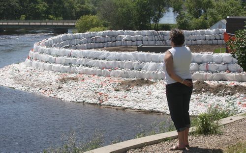 Leanne Rowat MLA Minnedosa  looks at  sandbag protection at the Souris water treatment plant which is threatened by flooding from the Souris River and Plum Creek - Nick Martin story  - June 29  2011   (JOE BRYKSA / WINNIPEG FREE PRESS)